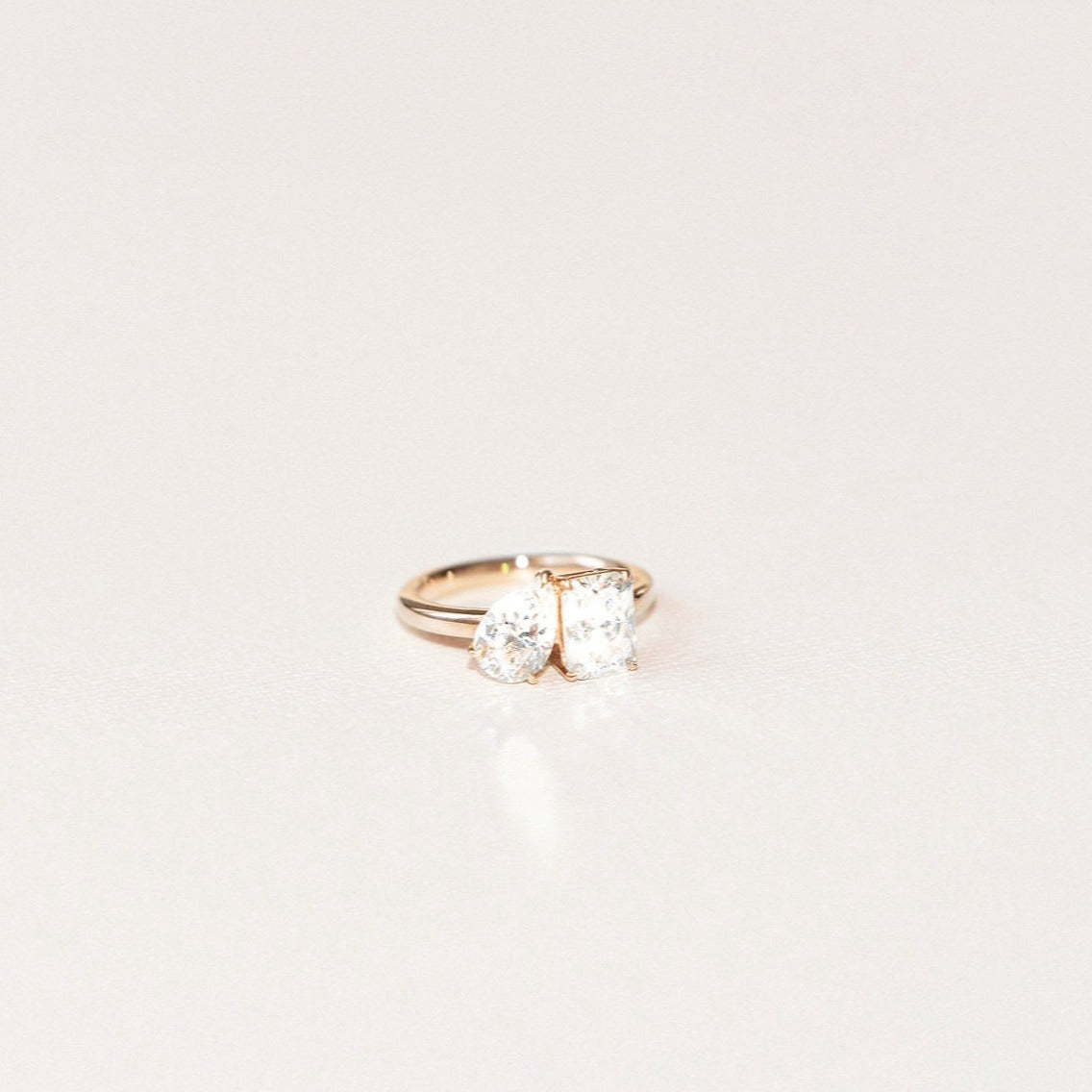 Toi et moi lab diamond engagement ring with pear and radiant cut stones in yellow gold.