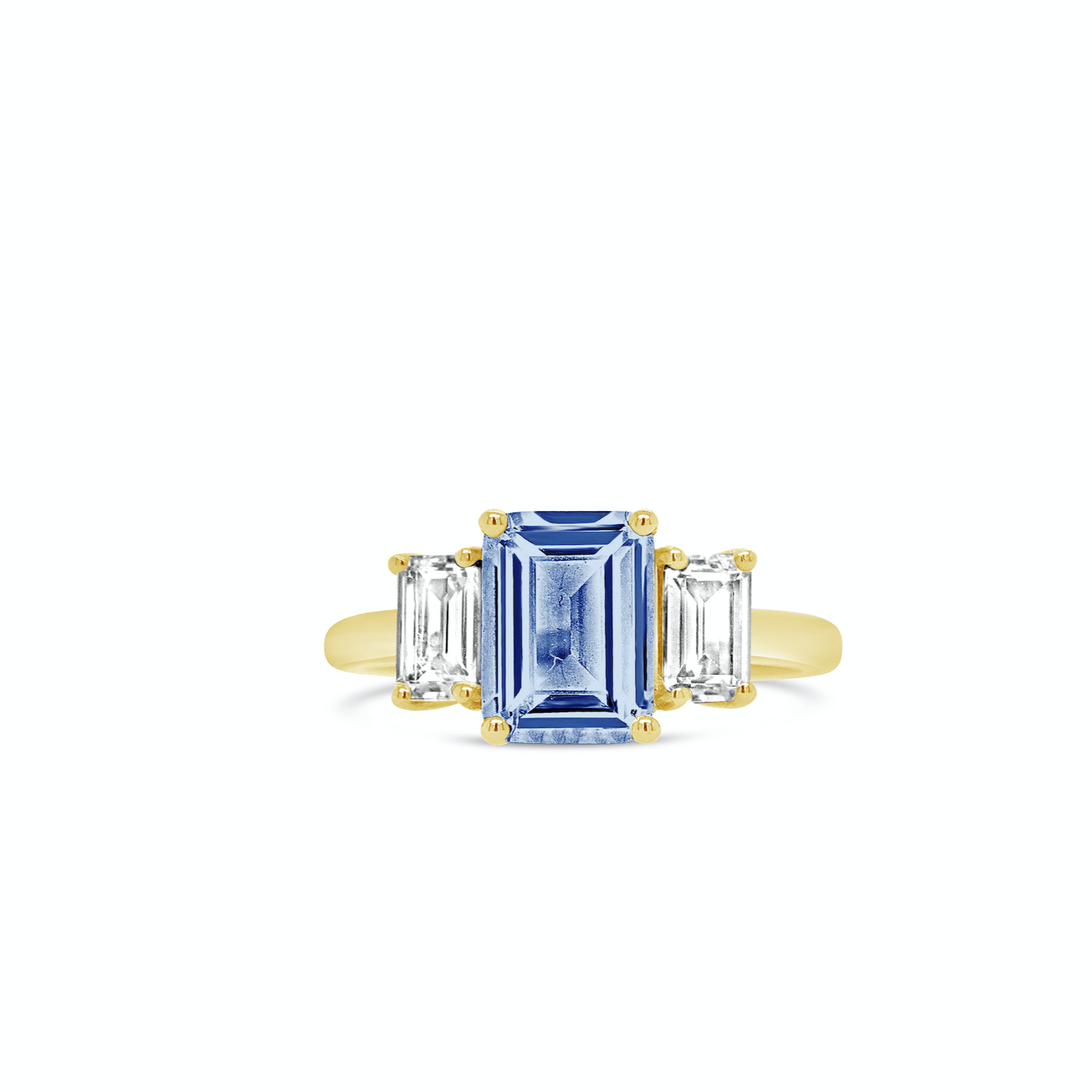 emerald cut blue sapphire engagement ring with trapezoid diamond side stones in yellow gold