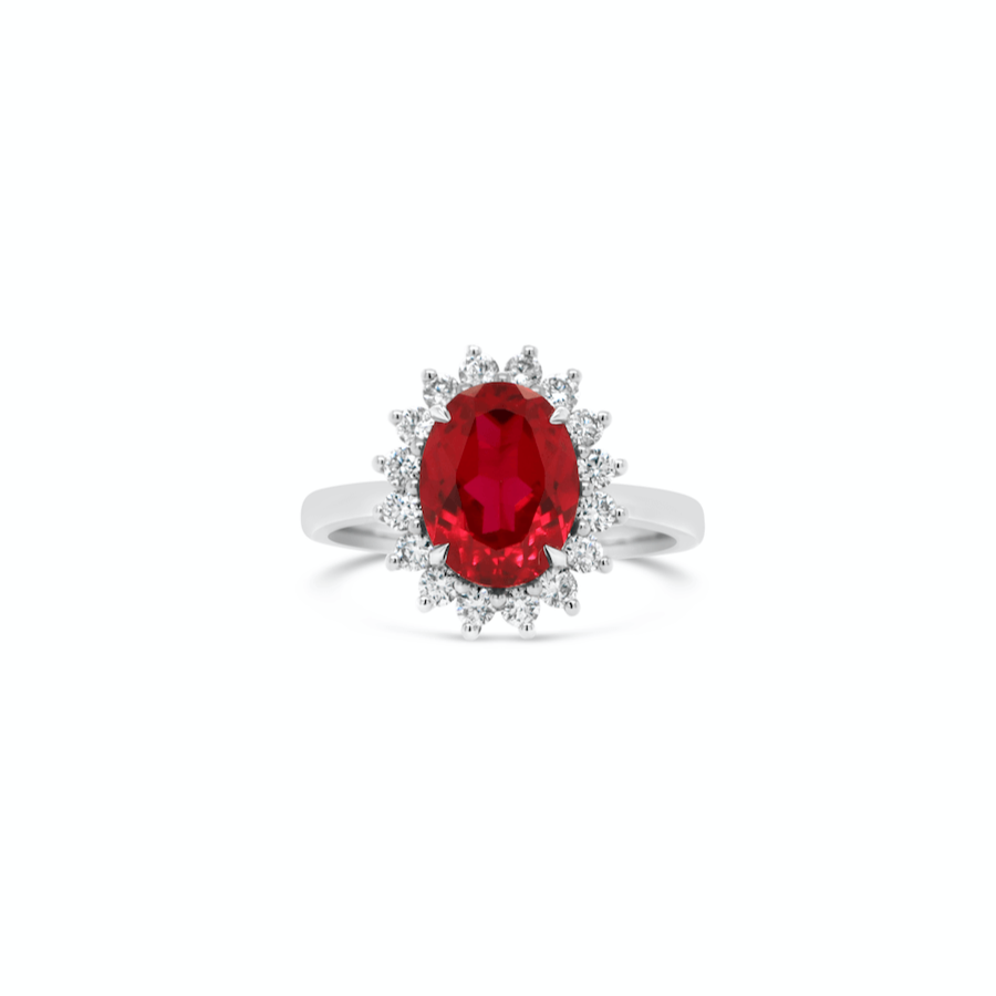oval ruby engagement ring with diamond halo in white gold band