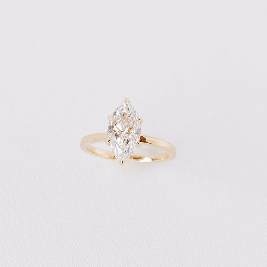 Marquise solitaire lab diamond engagement ring in 14k yellow gold with 2.02 carat centre stone on white background