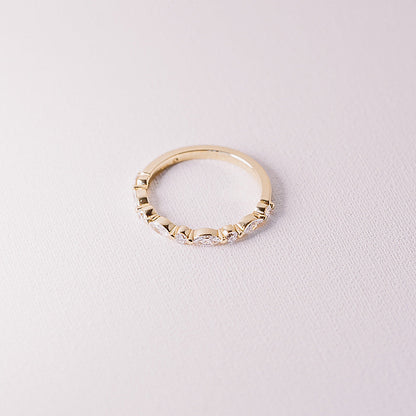 Ever After marquise and round lab diamond half eternity band in 14k yellow gold angled detail view on neutral background