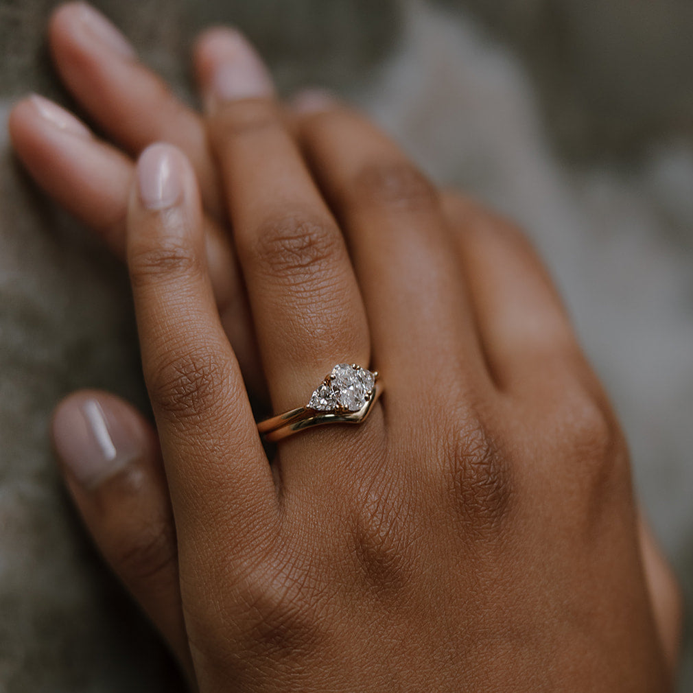 three-stone diamond ring with wedding band