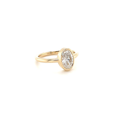 Video of a solitaire diamond engagement ring on a white background. 