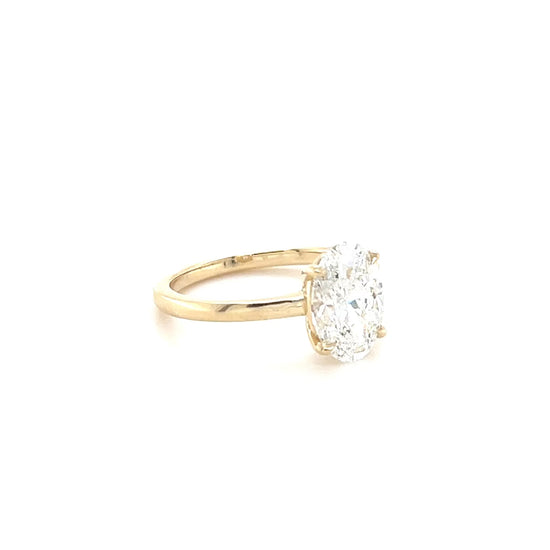 Over the Moon low-set oval lab diamond ring rotating on a white background